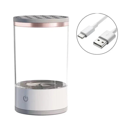Clear cylindrical Makeup Brush Cleaner humidifier with power button and USB cable on a white background