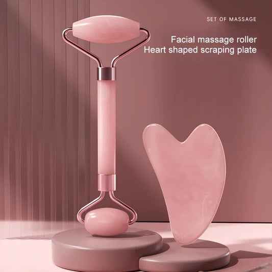 Facial massage roller with heart-shapedJade Roller for Face on a pink background