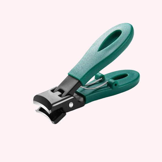Green pet nail clipper on a white background