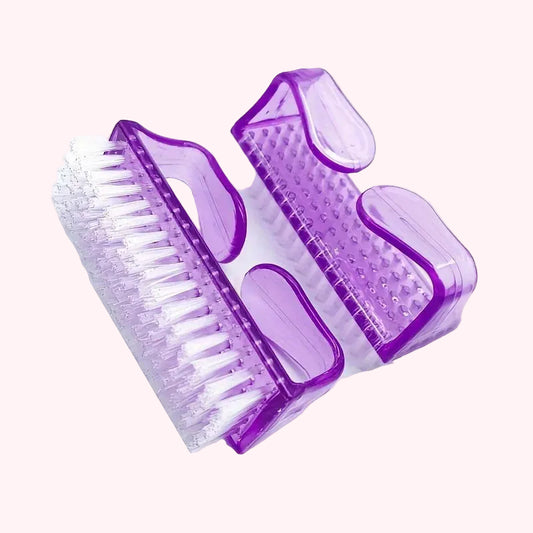 Purple nail brush with bristles on a white background