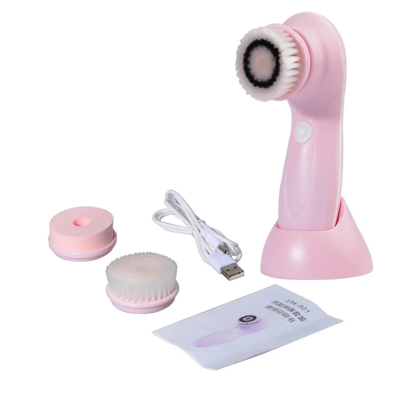 Pink facial cleansing brush set with attachments and USB cable on a white background