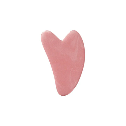 Pink heart-shaped Jade Roller for Face  on a white background