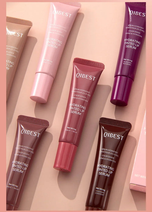 Coloured Lip Gloss in various shades displayed on a pastel background highlighting their hydrating formula.