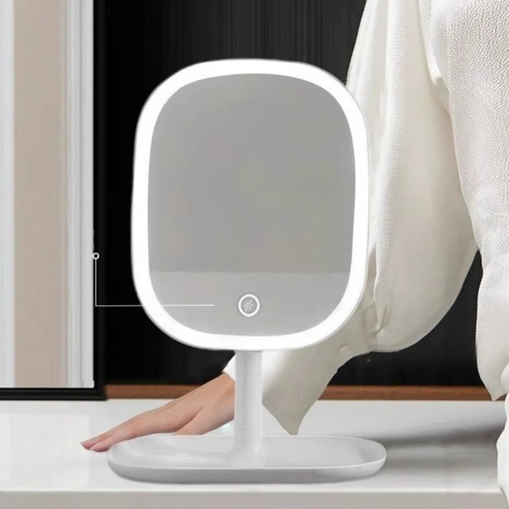 LED Vanity Mirror – Rotating Dimmable 3-Colour Light on a stand, person wearing white pants in the background