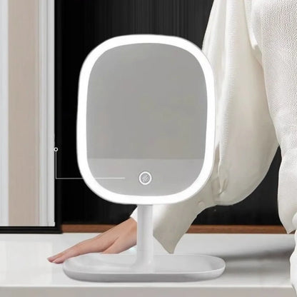 LED Vanity Mirror – Rotating Dimmable 3-Colour Light on a stand, person wearing white pants in the background