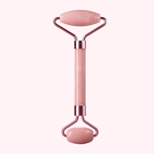 Pink Jade Roller for Face  with rose gold accents on a white background