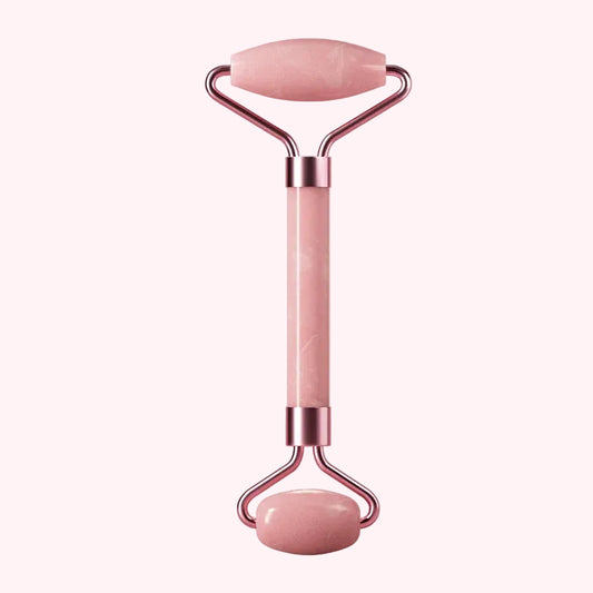 Pink Jade Roller for Face  with rose gold accents on a white background